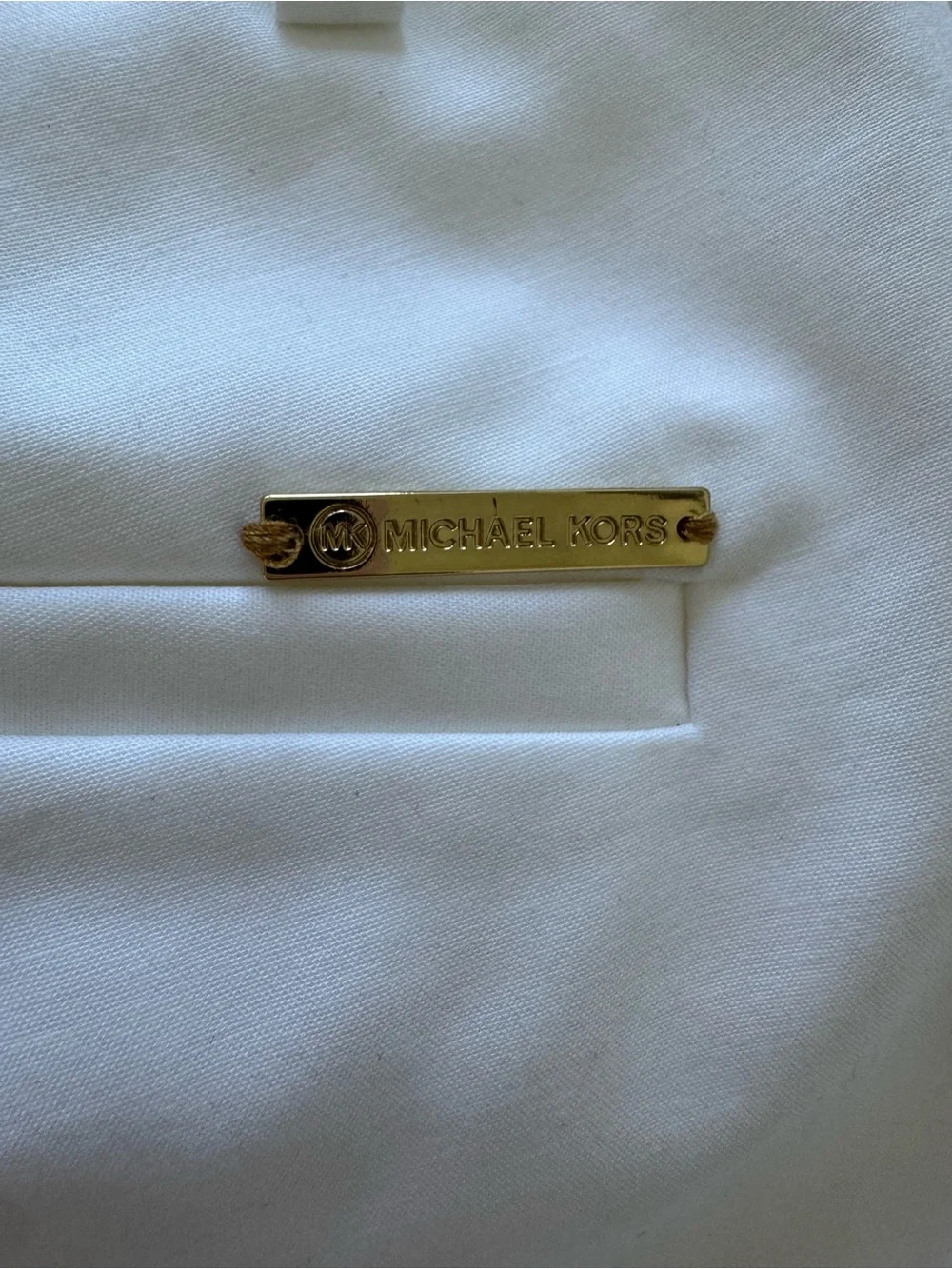 Michael Kors White Garment with Gold Logo Plaque